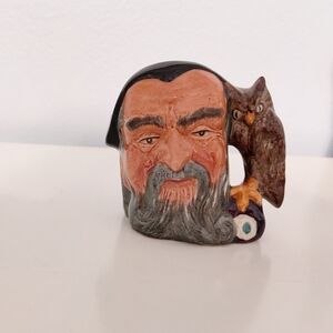 Royal Doulton Ceramic Figurine with Brown and Black Accents